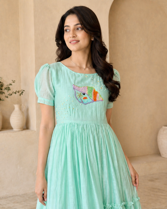 Pastel green frock with hand embroidery motif
