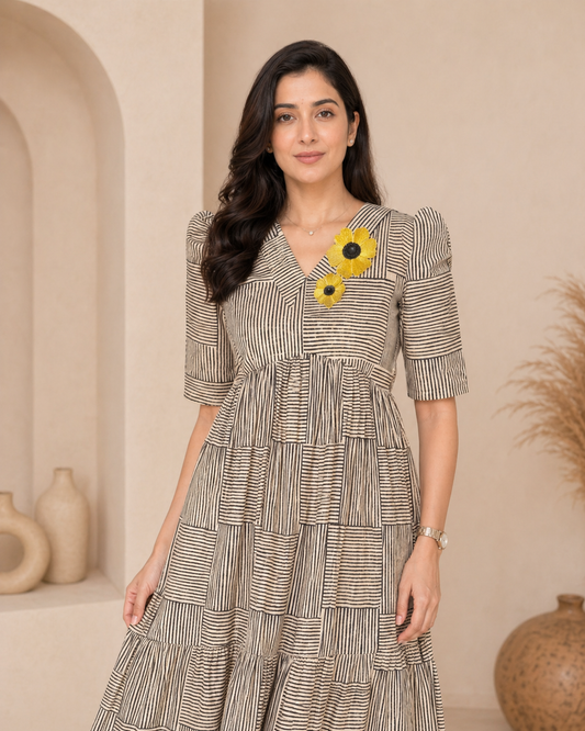 Black horizontal and vertical srtripes frock with sunflower aplique